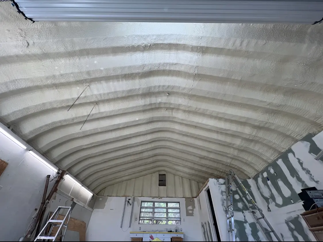 Spray polyurethane foam applied to the underside of a metal roof deck in Beacon Square